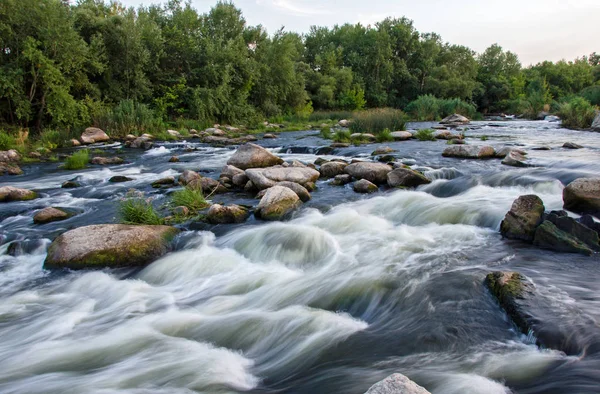 Fast flowing river and stones in  reserve — Stock Photo, Image