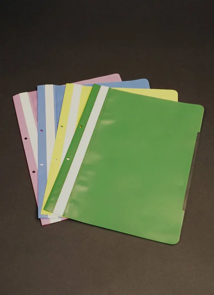 Document files, folders in various colors and thicknesses, available at home and in offices.