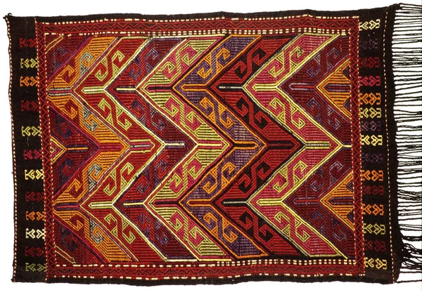 Rugs, carpets and pillows, hand-made, reflecting local culture.