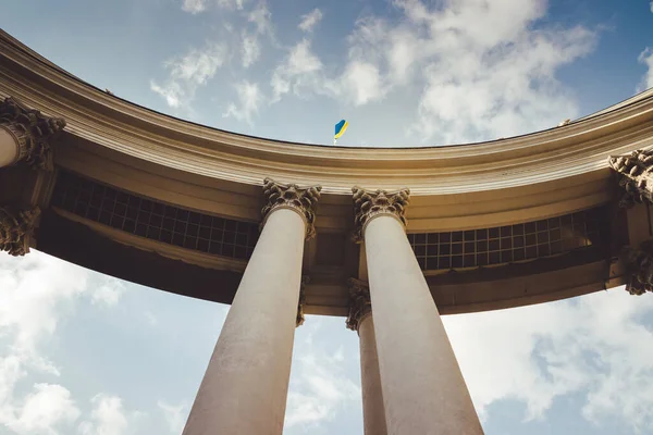 Portico of the building of the Ministry of Foreign Affairs. Ukraine flag flies on the arch of the Ministry of Foreign Affair. Beautiful columns