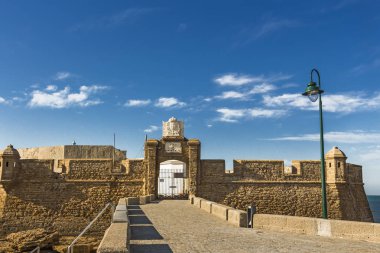 The front gate and fortress walls of Castillo de San Sebastian clipart