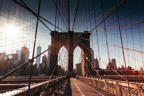 Scenic view of Brooklyn Bridge details in sunset light, New York, USA