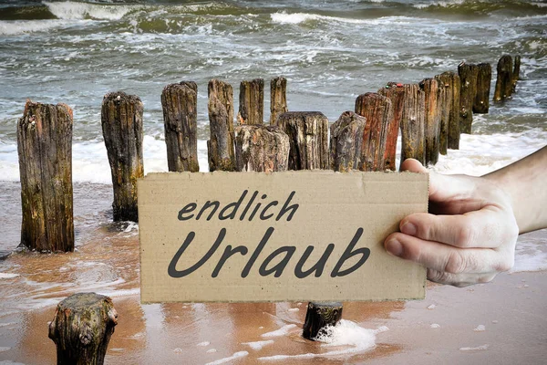 Hand Holding Sign Says Finally Holiday Baltic Sea Beach — Stock Photo, Image