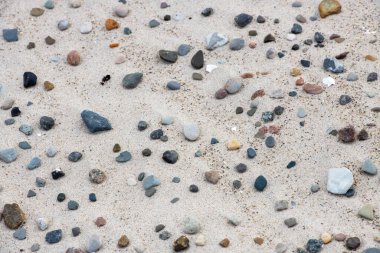 Sahilde çakıl taşları, arka plan olarak, doğa serisi.
