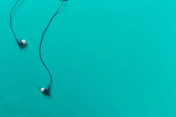 Black Earphones Blue Background — Stock Photo, Image