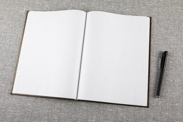 Pohled shora notebook na tmavošedá textura — Stock fotografie