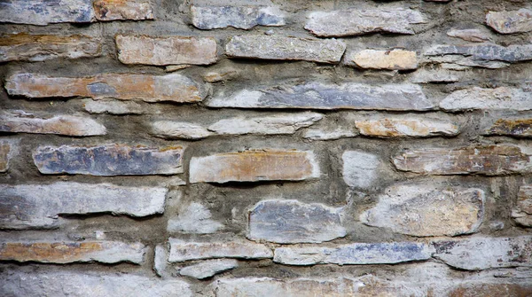 Una textura grumosa pared de ladrillo rojo — Foto de Stock