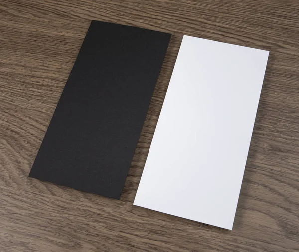 Blank flyer over wooden background to replace your design. — Stock Photo, Image