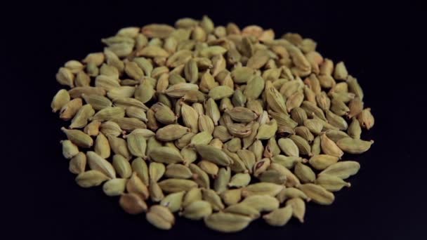 Green Cardamom Seeds Rotating Slow Motion Top View — Stock Video