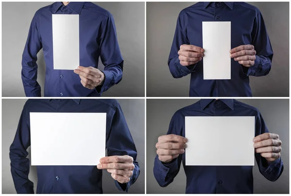 Un hombre sosteniendo membrete blanco —  Fotos de Stock