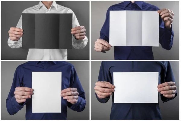 Un hombre sosteniendo un folleto blanco — Foto de Stock