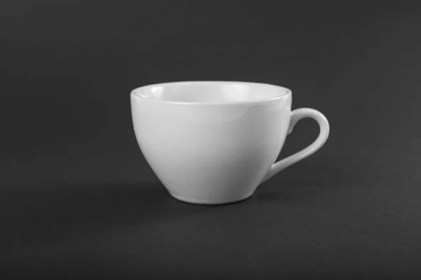 Empty white mug on a gray background. — Stock Photo, Image