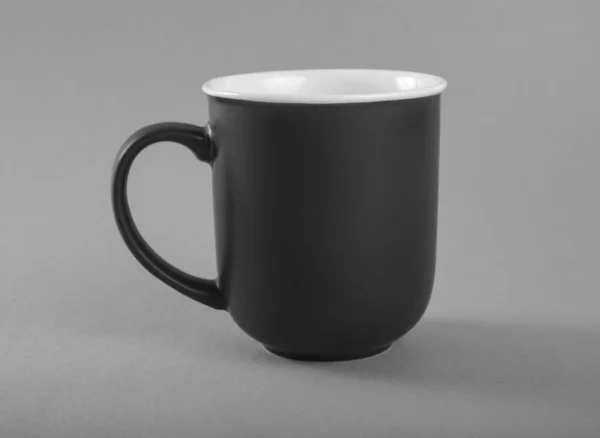 Empty gray mug on a gray background. — Stock Photo, Image