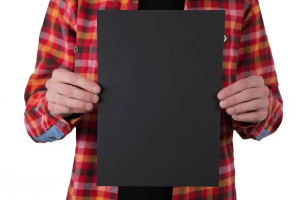 A man holding black letterhead — Stock Photo, Image