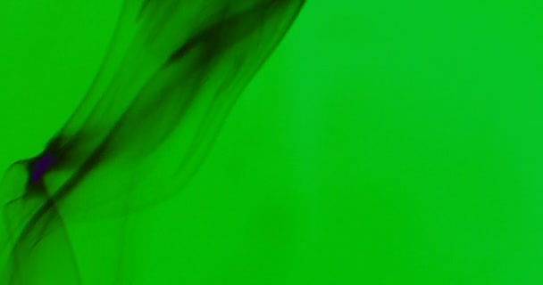Black Smoke Floating Space Green Background — Stock Video