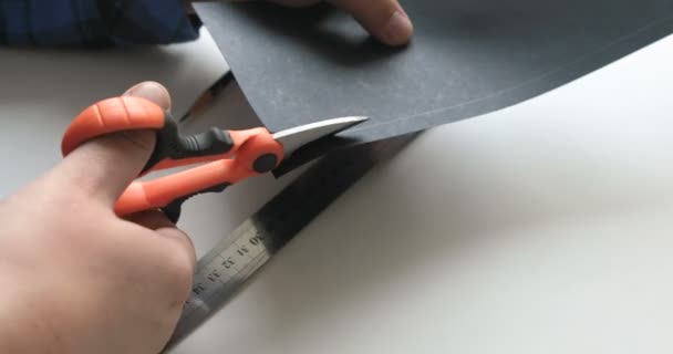 Man Cutting Sheet Paper Pair Scissors — Stock Video