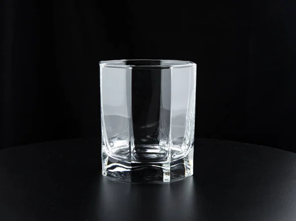 Empty glass on a black background — Stock Photo, Image