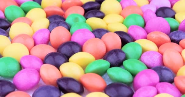 Bunte Schokoladenbonbons Rotieren Lebensmittel Hintergrund — Stockvideo