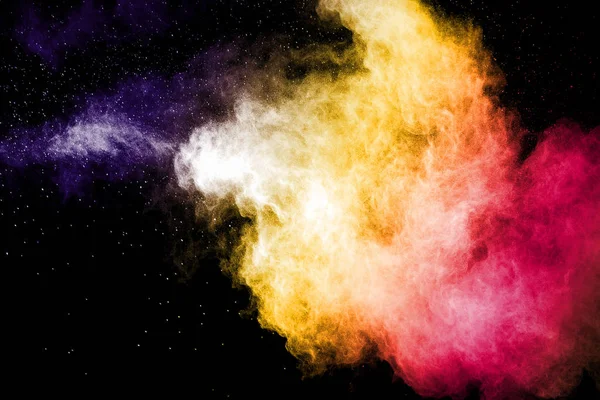 Stop the movement of multicolored powder on dark.