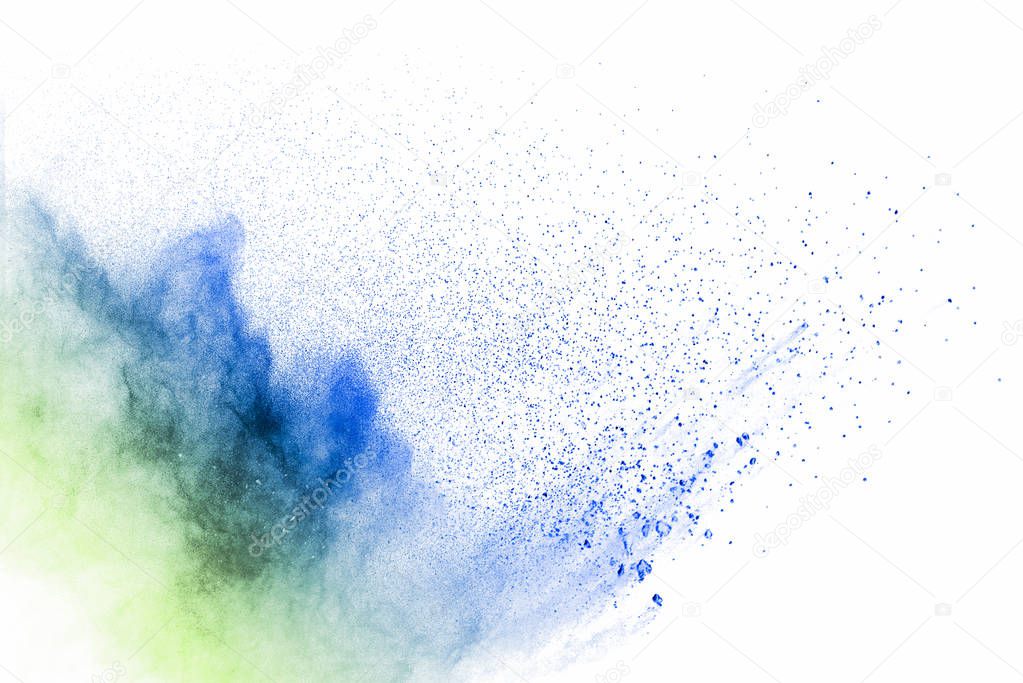 Explosion of blue and green dust on white background.