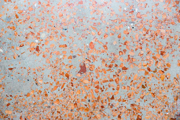 Grey stone background with red-brown inclusions — Stock Photo, Image