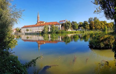 old town of landshut and isar river, with water reflection clipart