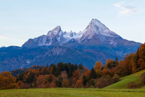 Typical mountain scenery in the background of the famous Watzmann Mountains in beautiful autumn colors near the cozy Berchtesgaden town in Bavaria, Germany