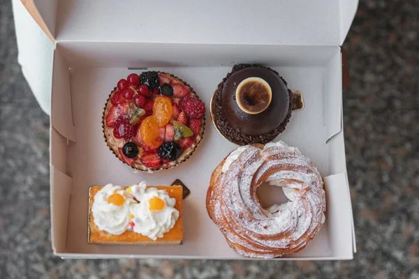 A variety of cakes in a box