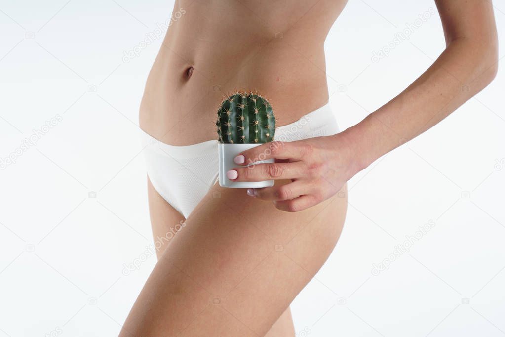 girl in white bikini holds a cactus bikini zone hair removal hair removal.