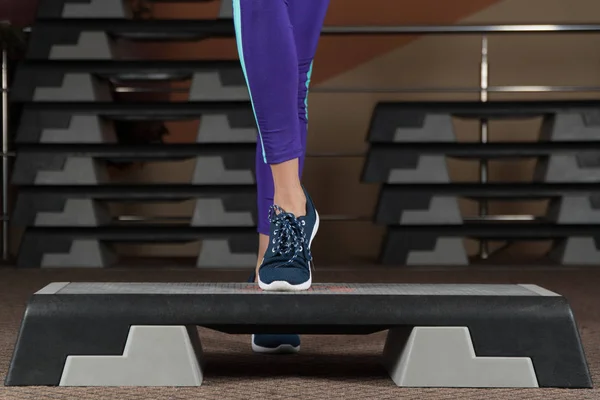 step platform. foot on step platform. classes in the gym. fitness aerobics.