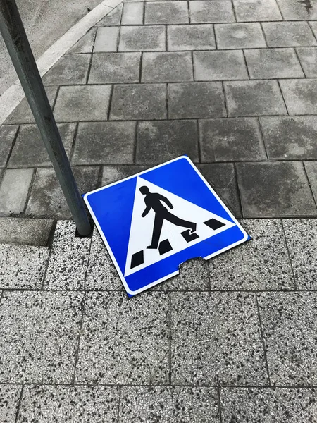 Broken crossroad sign, Vasagatan street, Stockholm, Sweden