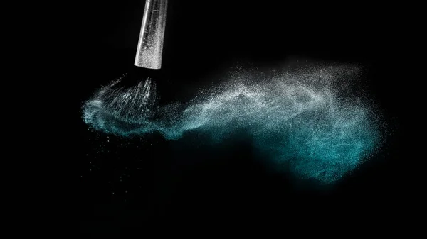 Cosmetic brush with blue cosmetic powder spreading for makeup ar — Stock Photo, Image