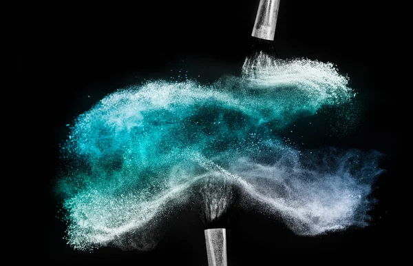 Cosmetic brush with blue cosmetic powder spreading for makeup ar — Stock Photo, Image