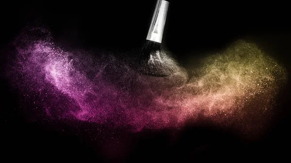 gold and purple powder splash and brush for makeup artist