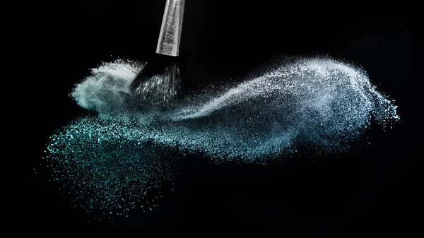 Deep ocean powder color splash and silver brush for makeup artis