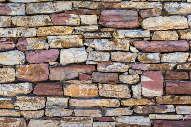 taştan bir duvar veya bir arka plan için bir taş çit bir parçası bir parçası bir closeup doku