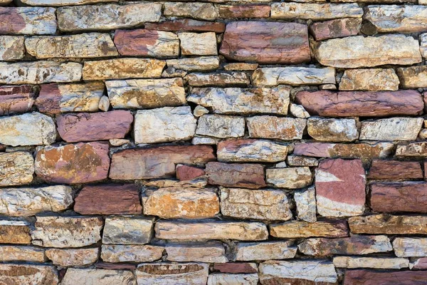 テクスチャの石の壁や背景のため石造りの塀の部分の断片のクローズ アップ — ストック写真