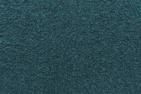 抽象的な青緑色のニット生地の暗い背景のテクスチャ — ストック写真