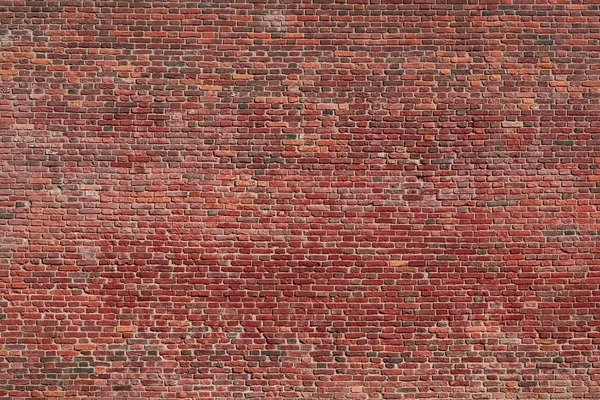 Vintage doku duvar kağıdı veya bir arka plan için eski bir tuğla duvar