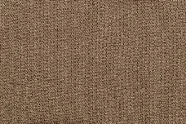 empty and clean background or wallpaper with abstract knitted texture of fabric or textile material a closeup of light brown color