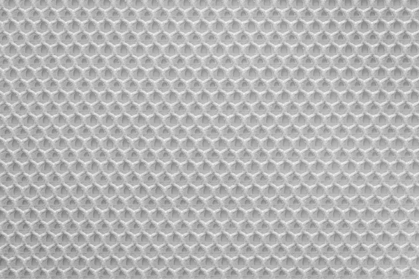 uniform corrugated texture of synthetic fabric or textile material of white color and closeup for a background