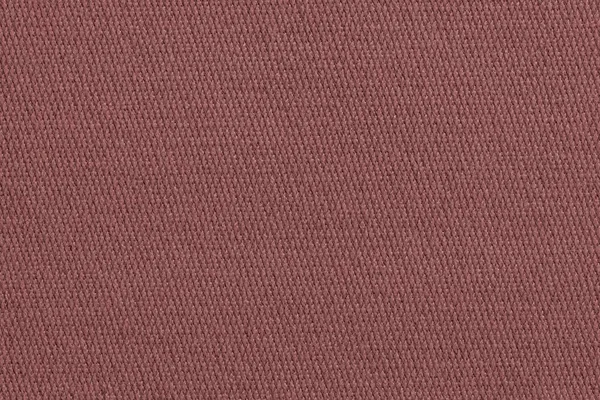 texture of a knitted cloth or textile material closeup for a uniform background or for wallpaper of fashionable lilac terracotta color