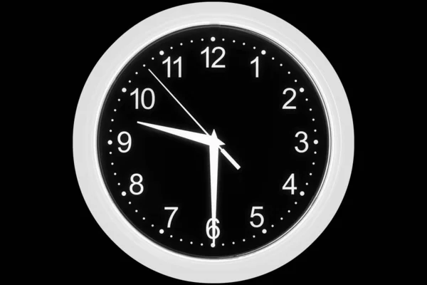 Clock dial on a black background — Stock Photo, Image