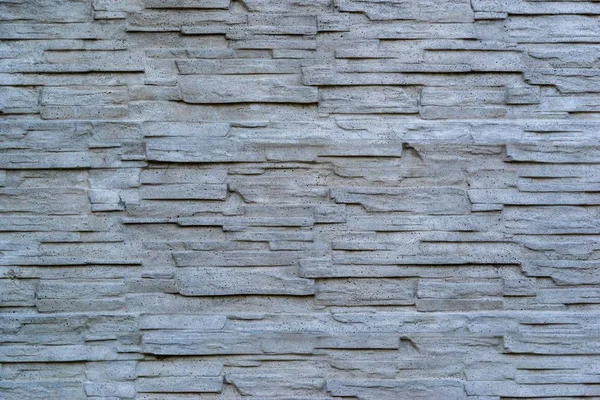 Vlnitá textura kamenné stěny — Stock fotografie