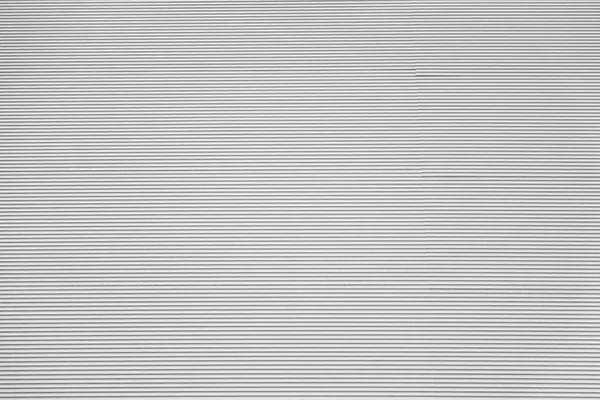 Corrugated or rough wavy textured background of light gray color — Stock Photo, Image