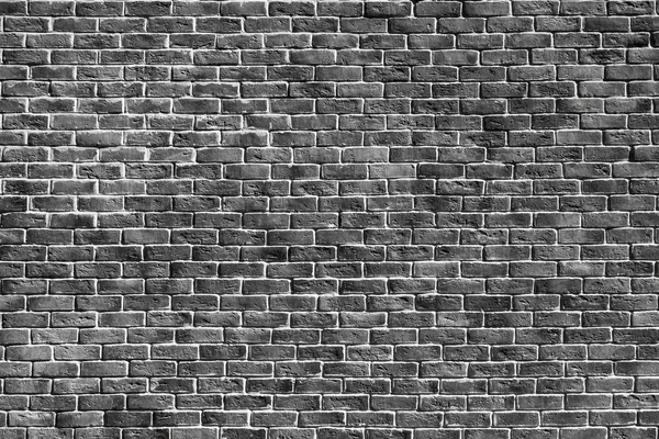 Fondo monocromo texturizado de una pared de ladrillo —  Fotos de Stock