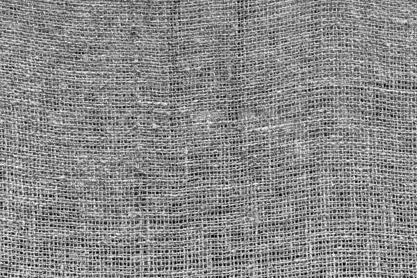 Texture of rough mesh fabric for a background of monochrome tone.