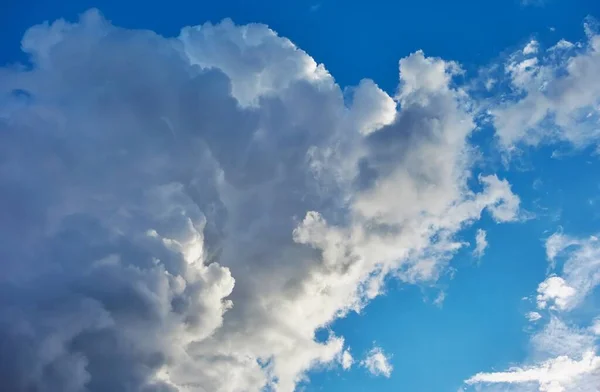 large gray cloud closeup on blue sky for natural background