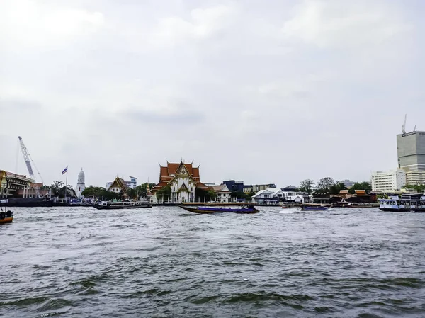 Passenger boats are running in the Chao Phraya River.