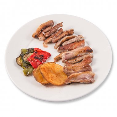 Grilled Secreto of Spanish Iberico pork cut with potatoes and grilled vegetables clipart